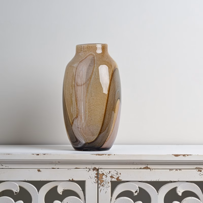 If you are looking for a stylish decorative vase in Kenya or Nairobi, this abstract ceramic vase is a beautiful choice for modern home décor. Its warm brown, beige and neutral tones make it easy to pair with different interior styles. It can be used as a decorative accent on a console table, TV stand, bookshelf, sideboard, entryway table or bedroom dresser. It is ideal for homeowners in Nairobi looking for elegant, unique and modern home décor accessories that add warmth and personality to their space.