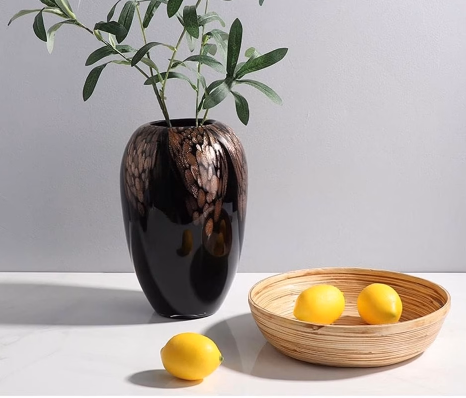 or anyone looking for a stylish decorative vase in Nairobi or Kenya, this black and brown vase is a sophisticated home décor choice. Its glossy black finish and warm brown artistic detailing make it ideal for modern, contemporary and elegant interiors. The vase can be placed on a console table, TV stand, sideboard, shelf, entryway table or bedroom dresser. It can also be styled with artificial branches, dried flowers or decorative foliage, making it a versatile statement piece for homeowners who want to add character and elegance to their space.